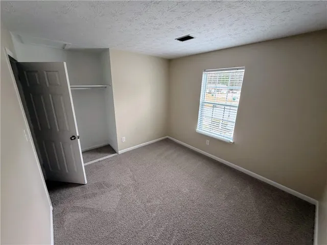 a bathroom with a toilet and a sink