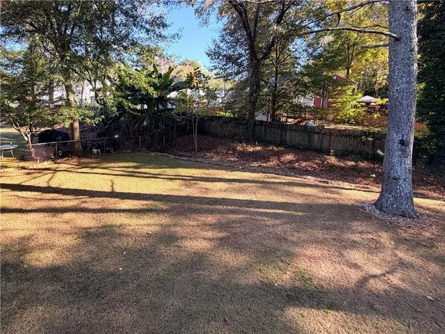 a view of a house with basketball yard