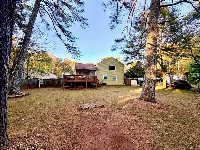 a view of a yard with a tree