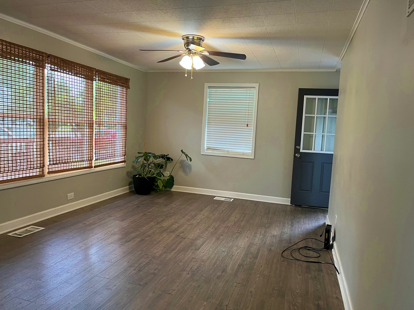 2909 Owl Drive Rolling Meadows, IL 60008 - Photo 3 of 11 a view of an empty room with a window and wooden floor