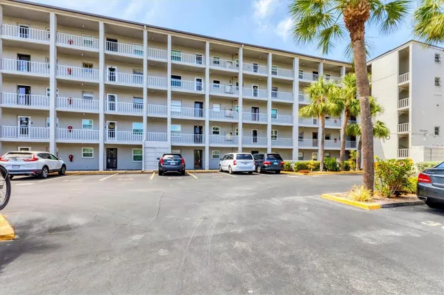 a view of building with parking area
