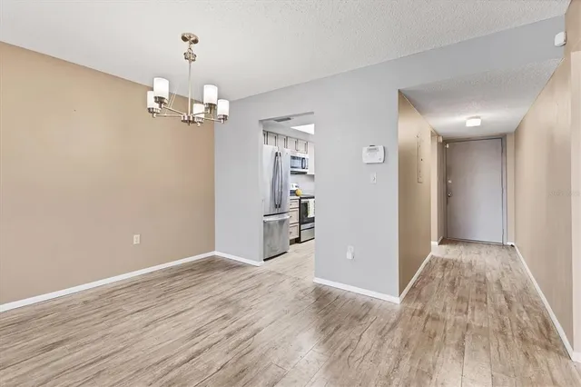 a view of a livingroom with wooden floor