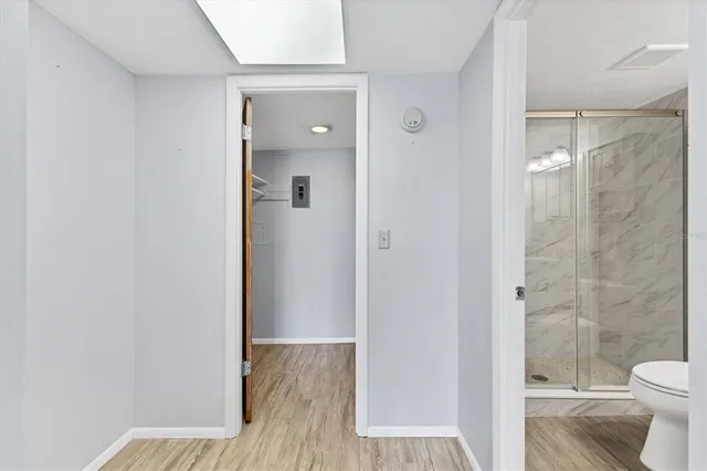 a bathroom with a sink toilet vanity and shower