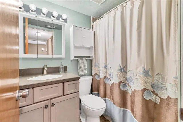 a view of a bedroom with washer and dryer