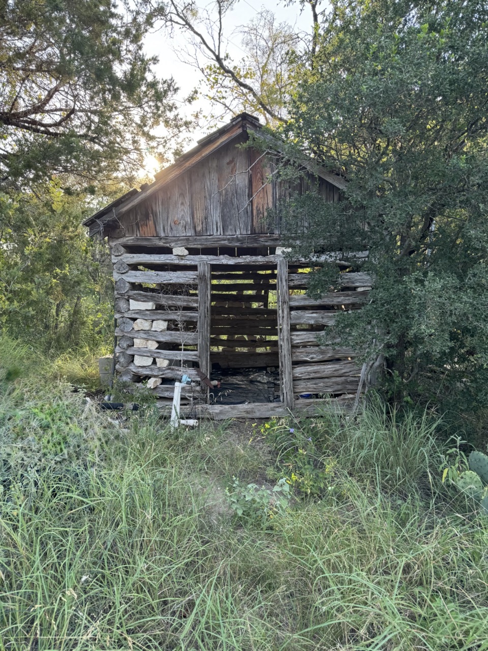 25723 Hamilton Pool Road Round Mountain, TX 78663 - Photo 4 of 32 Old Cabin at the entrance of the property