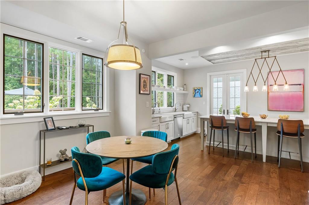 7255 Old Rico Road Chattahoochee Hills, GA 30268 - Photo 18 of 78 a view of a dining room with furniture window and wooden floor