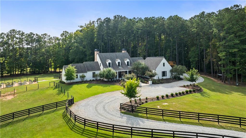 7255 Old Rico Road Chattahoochee Hills, GA 30268 - Photo 2 of 78 a view of a swimming pool with a patio
