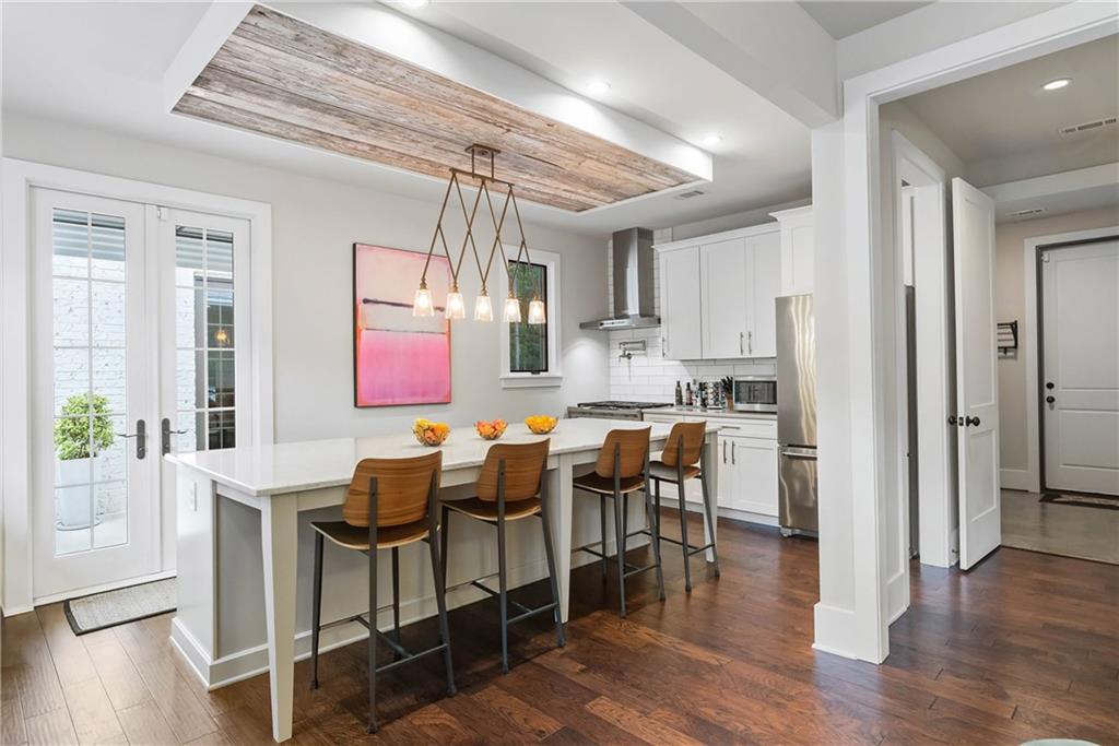 7255 Old Rico Road Chattahoochee Hills, GA 30268 - Photo 23 of 78 a view of a dining room with furniture and wooden floor