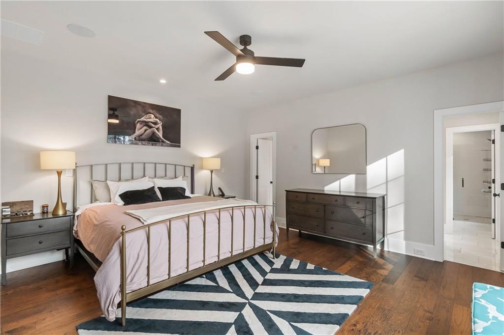 7255 Old Rico Road Chattahoochee Hills, GA 30268 - Photo 29 of 78 a bedroom with a bed and a chandelier