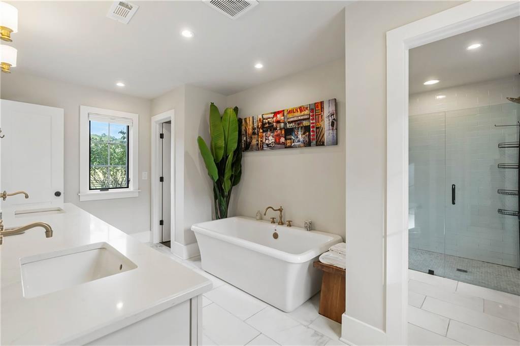 7255 Old Rico Road Chattahoochee Hills, GA 30268 - Photo 31 of 78 a bathroom with a bathtub and a sink