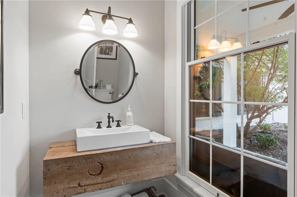 7255 Old Rico Road Chattahoochee Hills, GA 30268 - Photo 34 of 78 a bathroom with a sink and a mirror