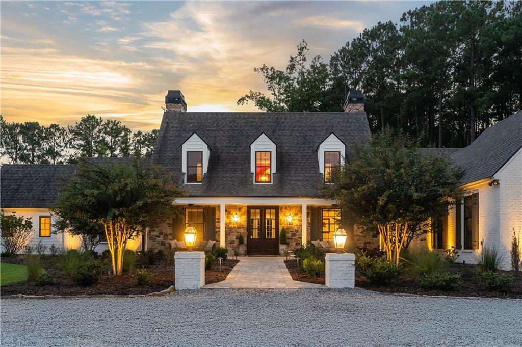 7255 Old Rico Road Chattahoochee Hills, GA 30268 - Photo 4 of 78 a front view of a house with a yard and tree s
