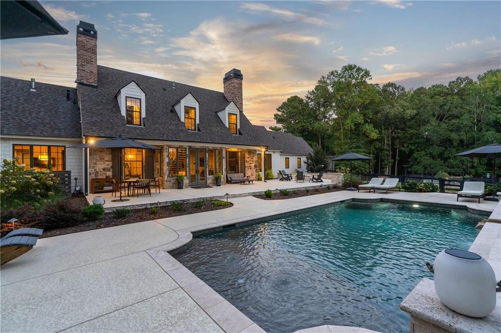 7255 Old Rico Road Chattahoochee Hills, GA 30268 - Photo 53 of 78 a view of a swimming pool with sitting area