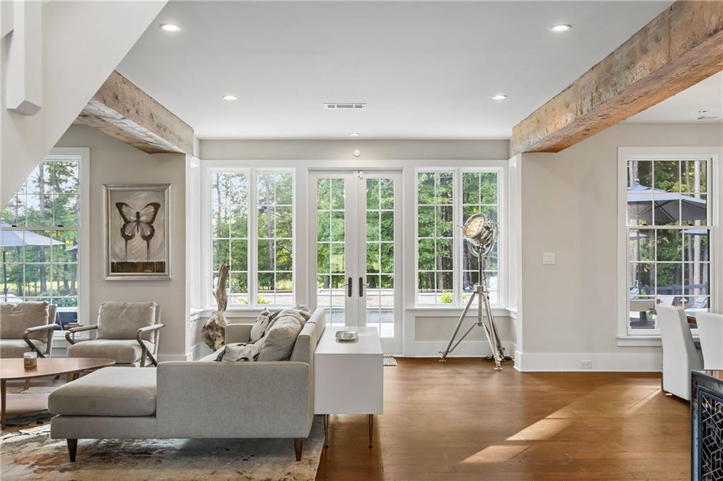 7255 Old Rico Road Chattahoochee Hills, GA 30268 - Photo 6 of 78 a living room with furniture and large windows