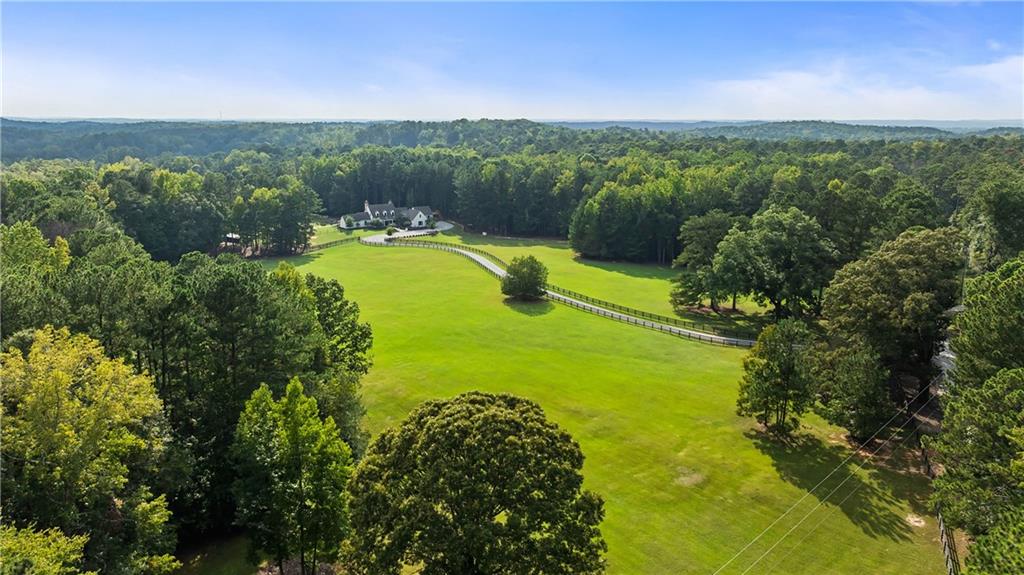 7255 Old Rico Road Chattahoochee Hills, GA 30268 - Photo 78 of 78 a view of a lake with a mountain in the background