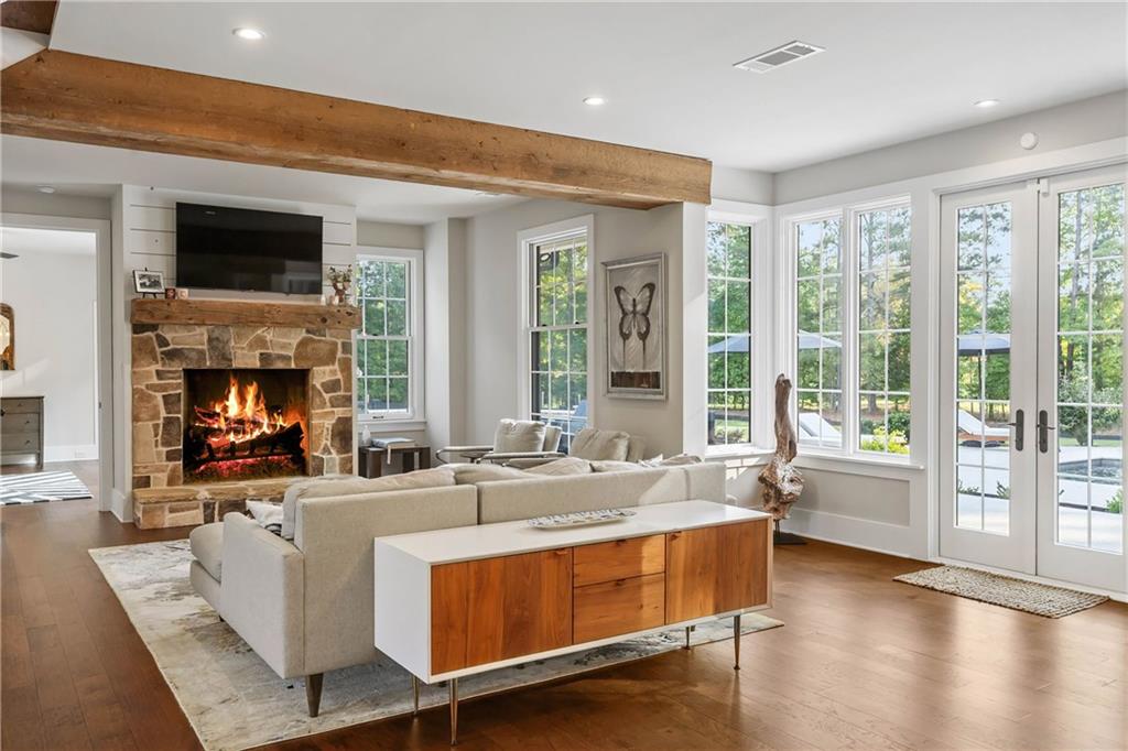 7255 Old Rico Road Chattahoochee Hills, GA 30268 - Photo 8 of 78 a living room with fireplace furniture and a large window