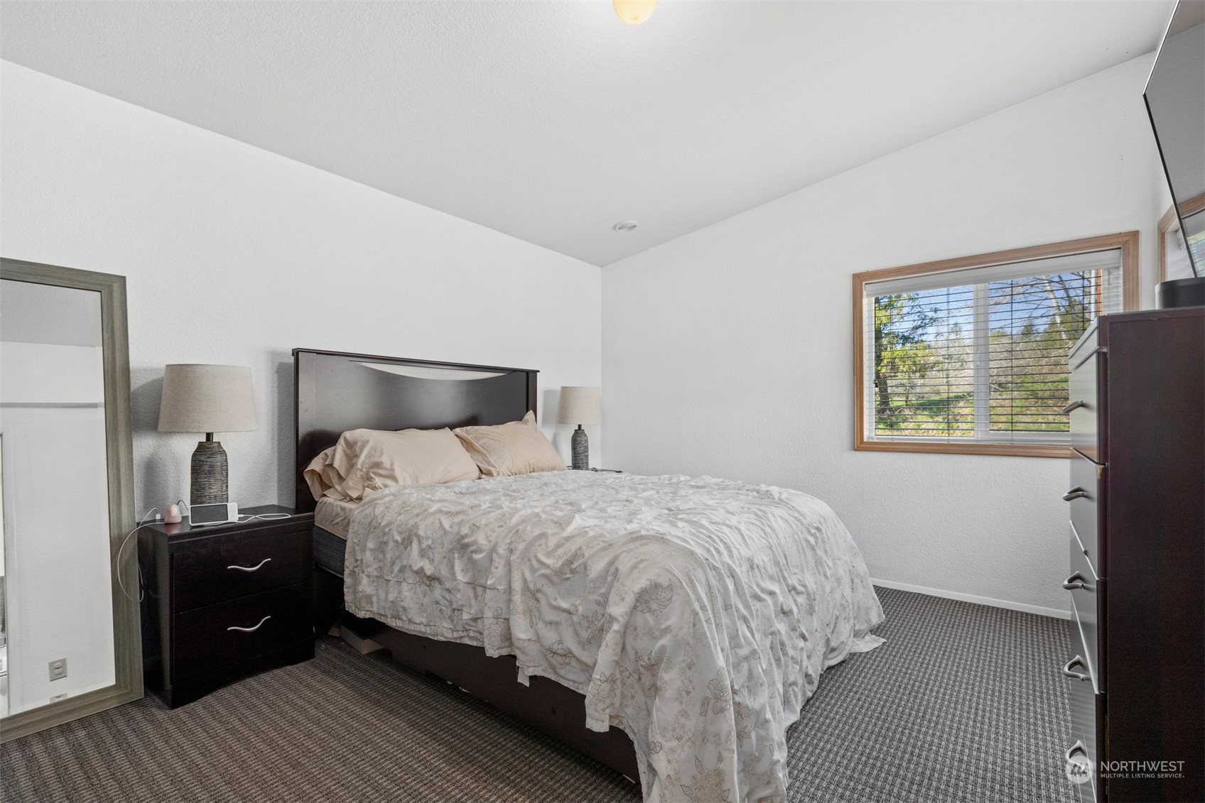 4859 Noon Road Bellingham, WA 98226 - Photo 33 of 40 a bedroom with a bed and wooden floor