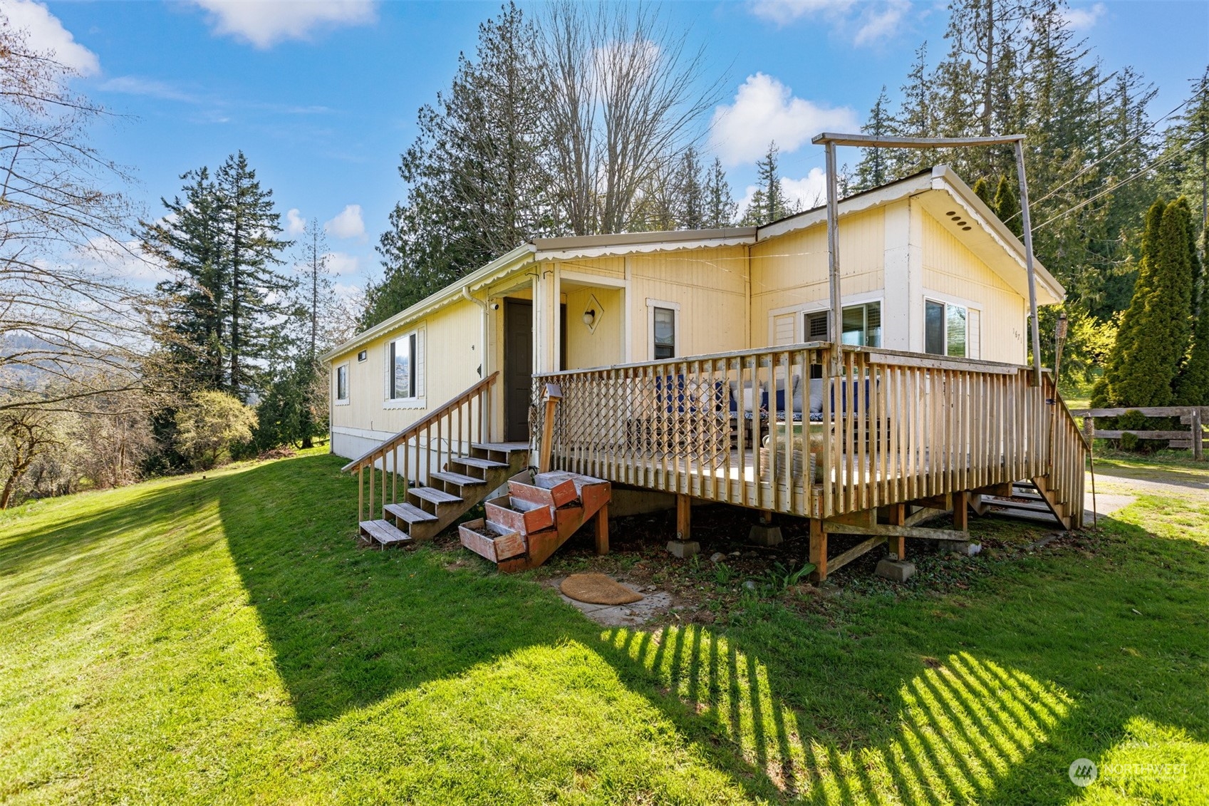 4859 Noon Road Bellingham, WA 98226 - Photo 4 of 40 a view of a house with a yard and deck