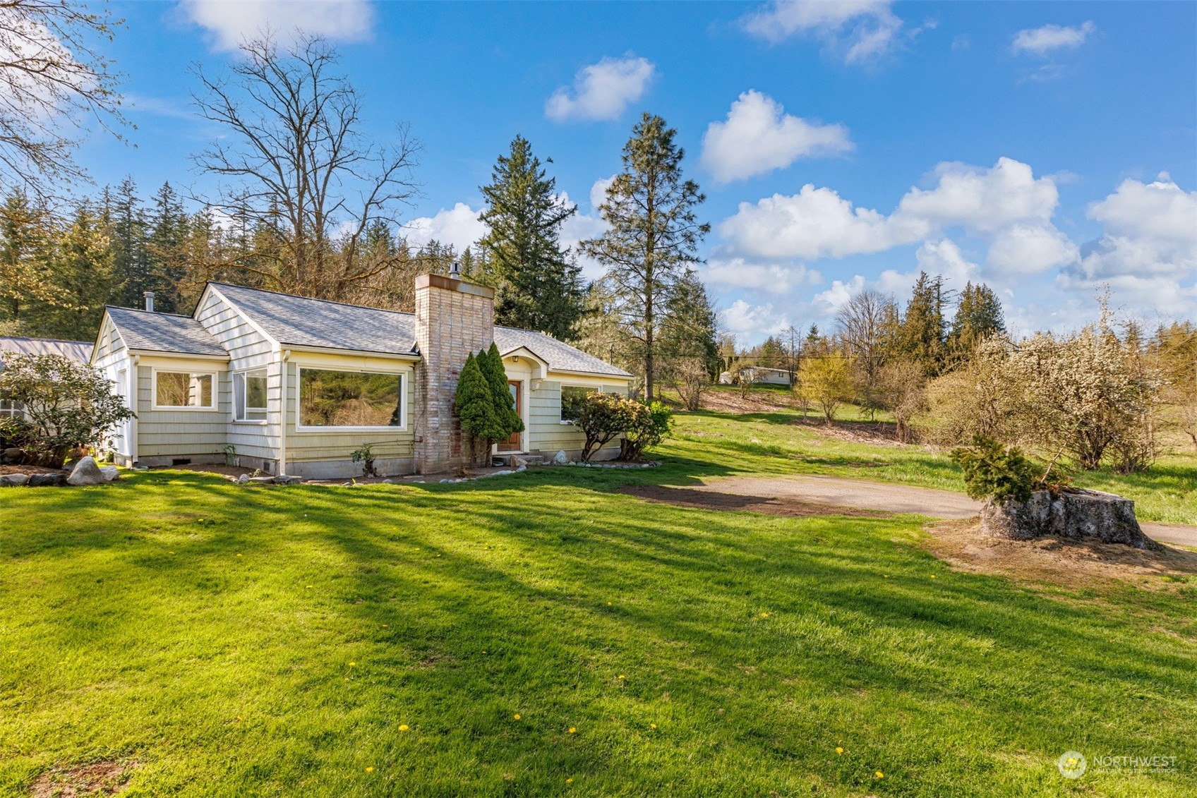 4859 Noon Road Bellingham, WA 98226 - Photo 5 of 40 a front view of a house with a garden
