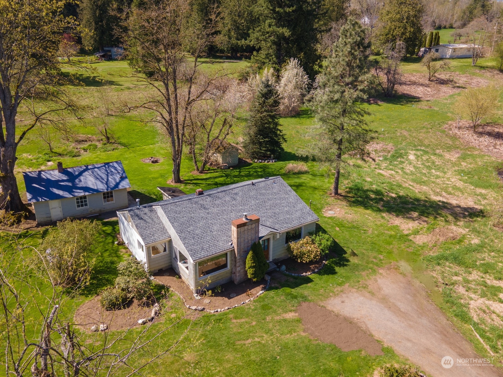 4859 Noon Road Bellingham, WA 98226 - Photo 9 of 40 an aerial view of a house with a yard basket ball court and outdoor seating