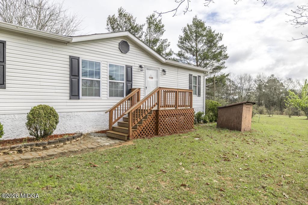 319 Pope Road Roberta, GA 31078 - Photo 6 of 42 a front view of a house with a yard