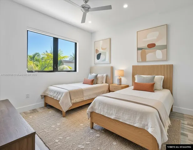 a bathroom with a bathtub shower sink vanity and toilet