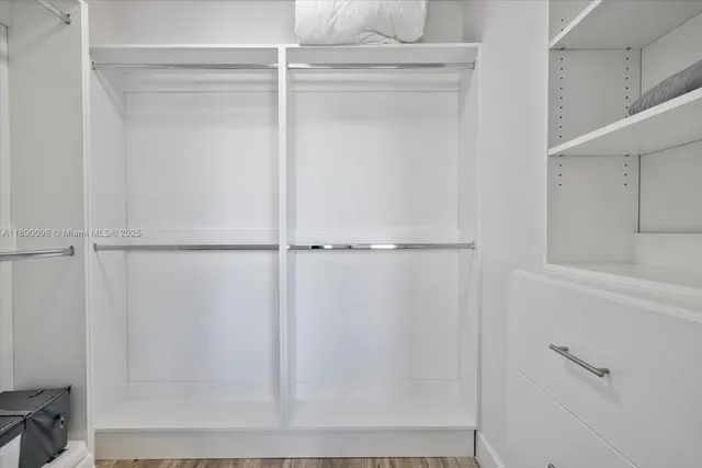 a bedroom with a large bed and a couch