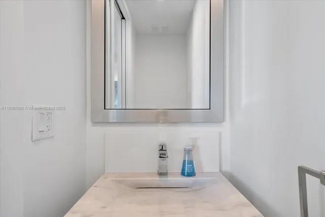 a utility room with sink dryer and washer