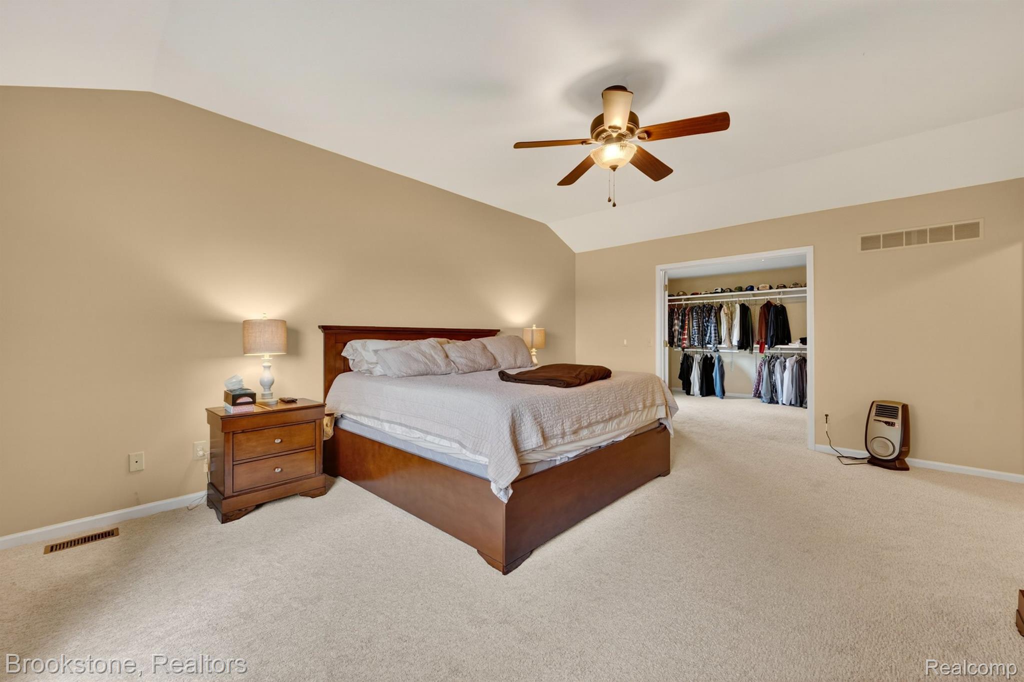 4054 Calumet Drive Rochester, MI 48306 - Photo 31 of 44 Bedroom featuring vaulted ceiling, a spacious closet, light carpet, and a ceiling fan