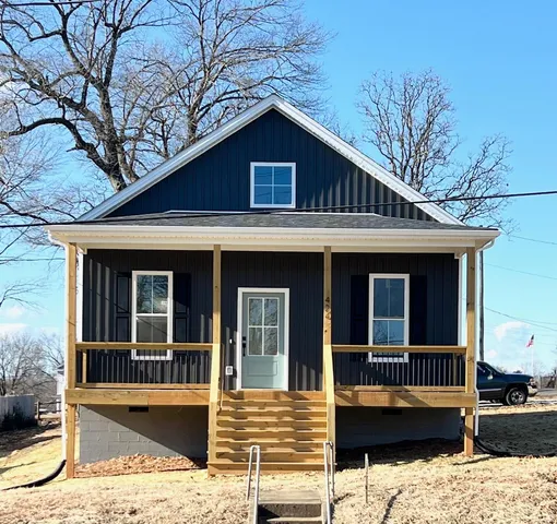a view of a house with large windows