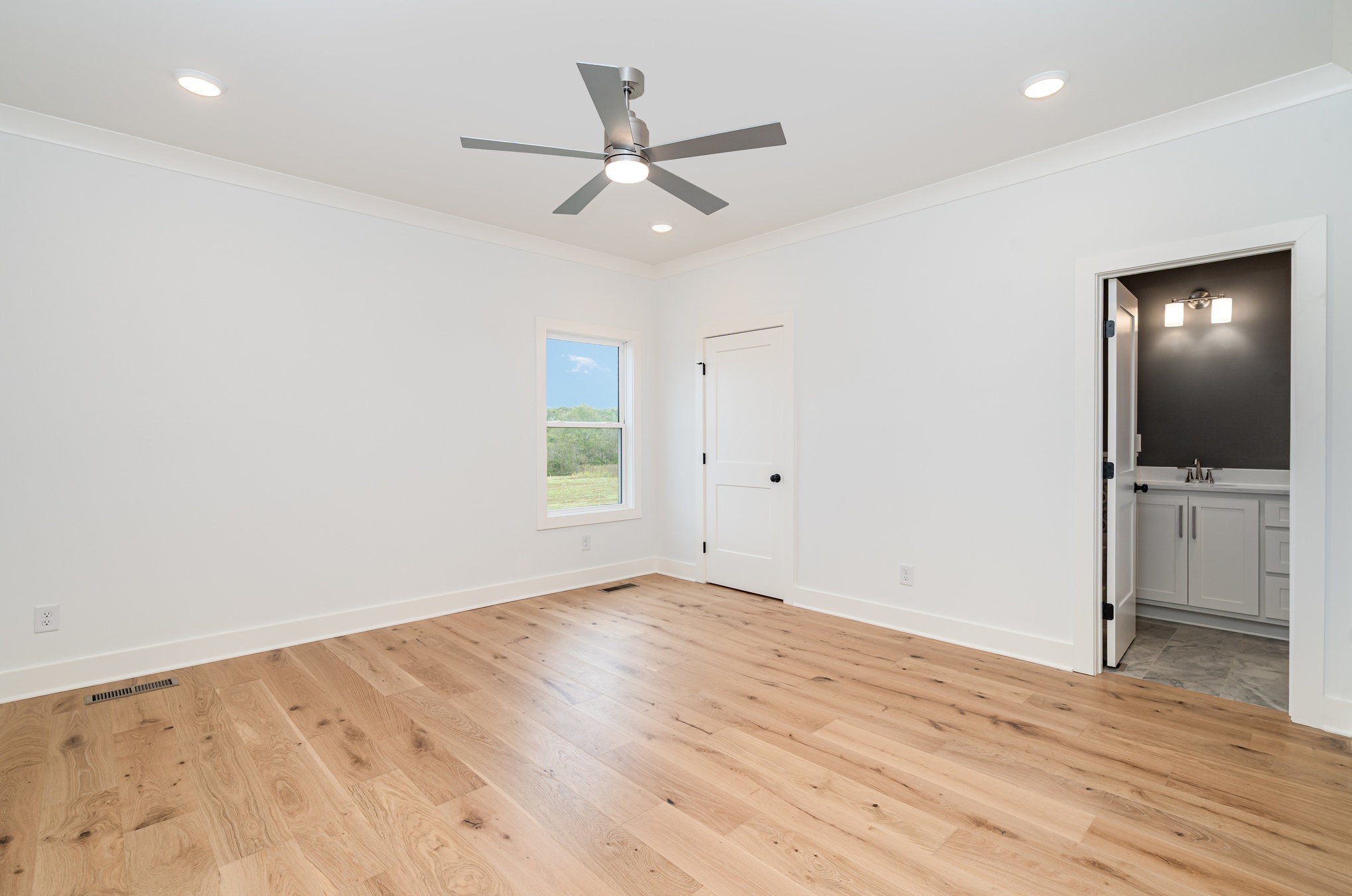 95 Crenshaw Road Hartsville, TN 37074 - Photo 11 of 31 wooden floor in an empty room with a window