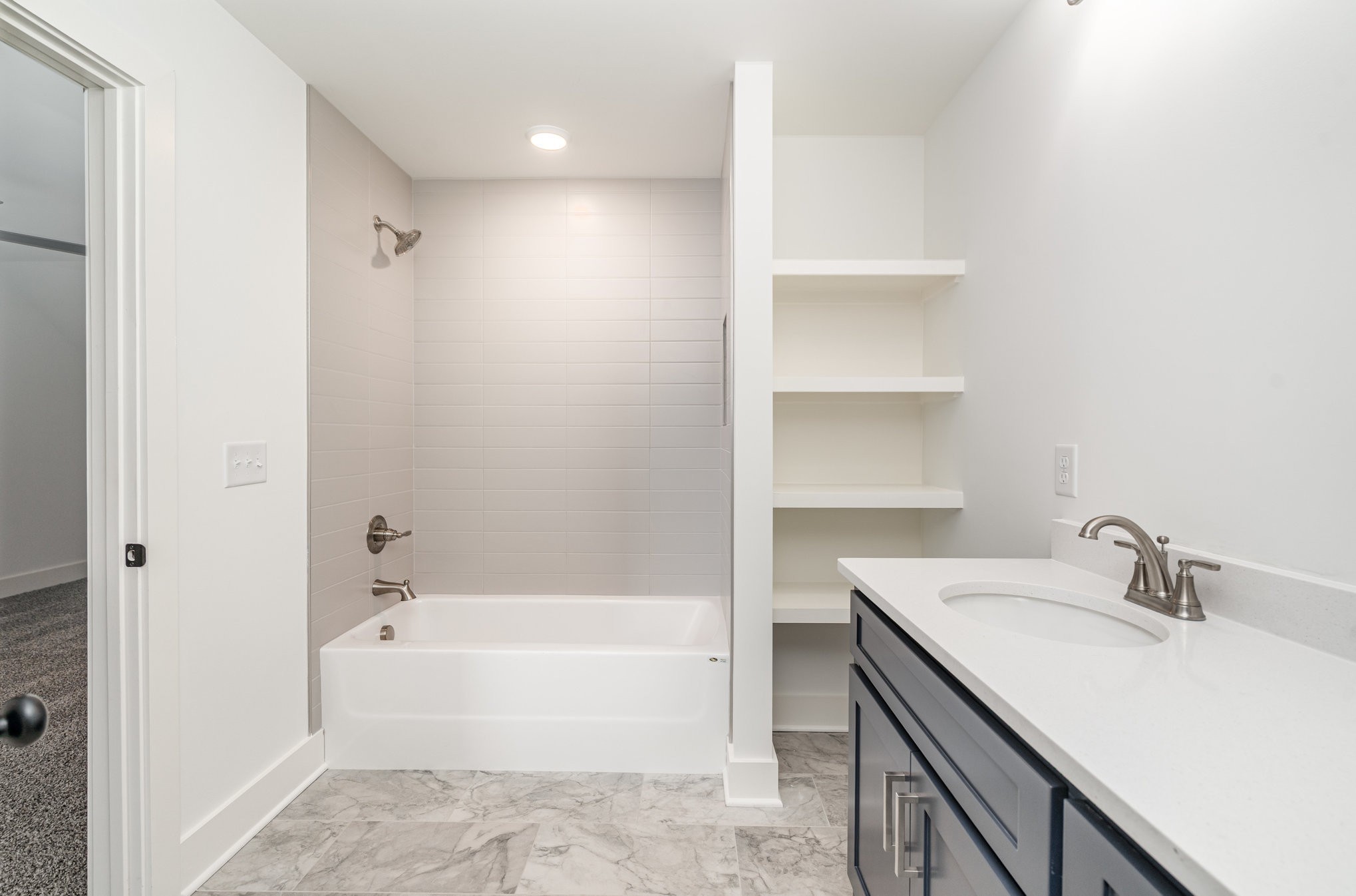 95 Crenshaw Road Hartsville, TN 37074 - Photo 21 of 31 a bathroom with a bathtub a sink a vanity and a shower