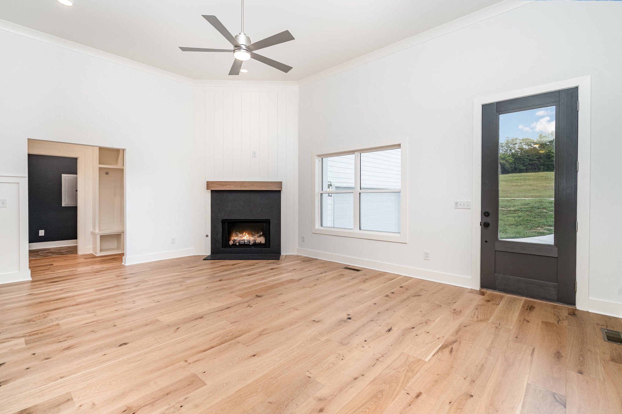 95 Crenshaw Road Hartsville, TN 37074 - Photo 6 of 31 an empty room with windows and a fireplace