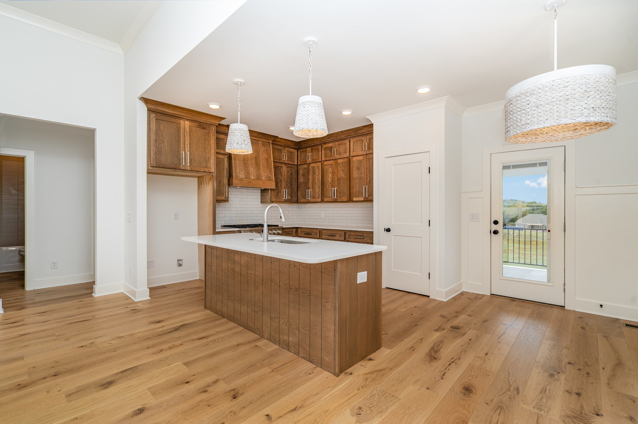 95 Crenshaw Road Hartsville, TN 37074 - Photo 8 of 31 a kitchen with stainless steel appliances granite countertop a sink a stove and a wooden floors