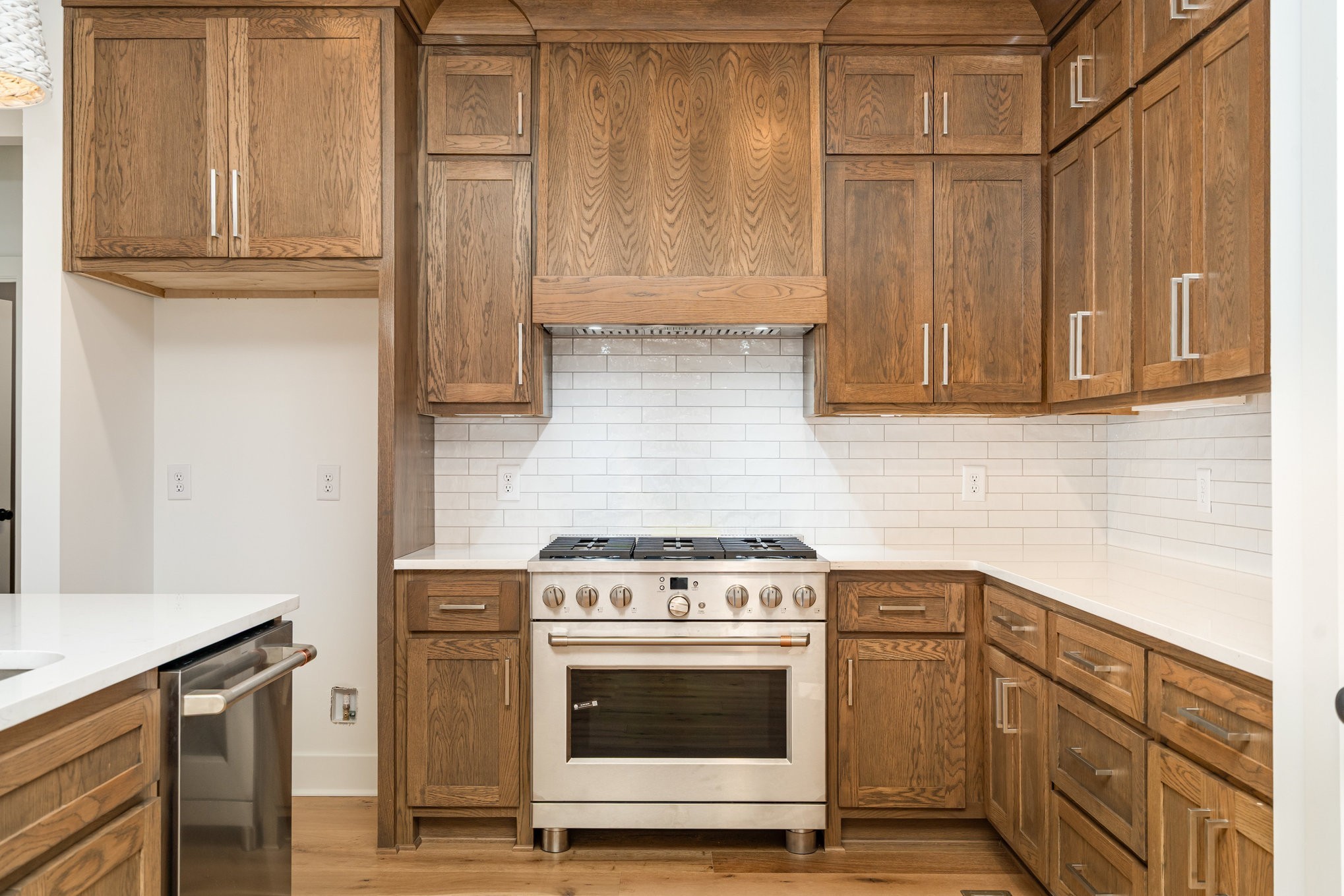 95 Crenshaw Road Hartsville, TN 37074 - Photo 9 of 31 a kitchen with stainless steel appliances wooden cabinets and a stove top oven