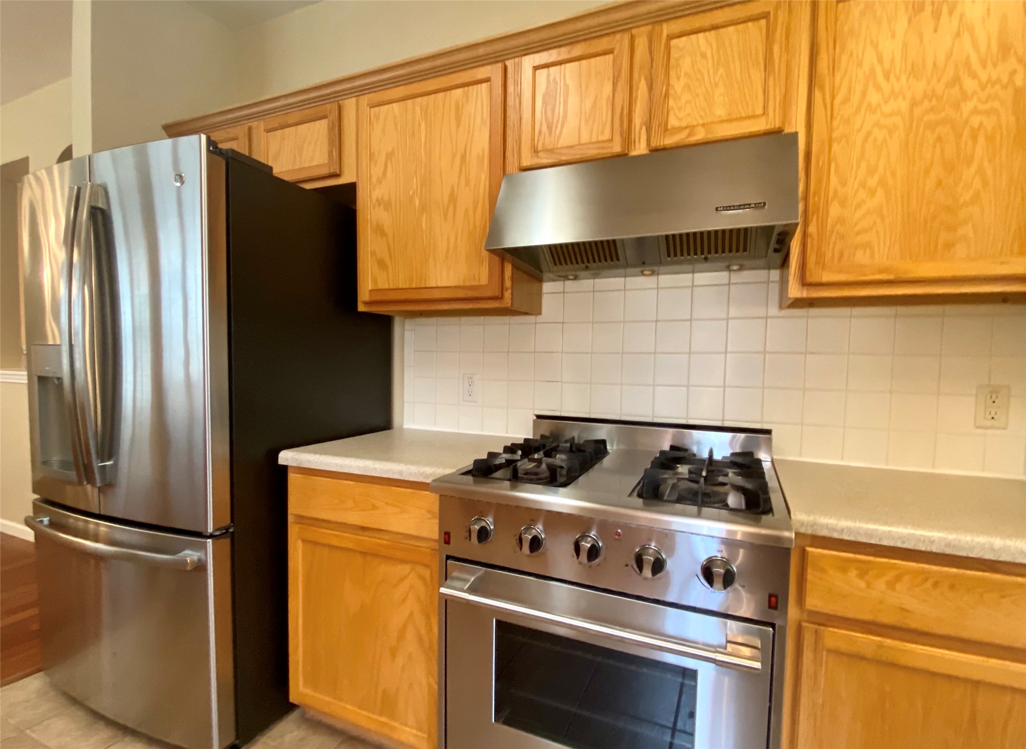 4615 Tello Path Austin, TX 78749 - Photo 6 of 29 A well-appointed kitchen showcasing durable wood cabinetry, practical countertops, and stainless steel appliances.