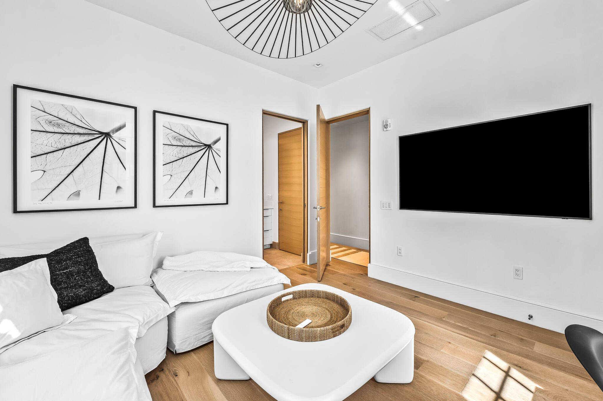 290 Sea Garden St Inlet Beach, Unit 402 Inlet Beach, FL 32461 - Photo 14 of 43 a living room with a flat screen tv and a couch