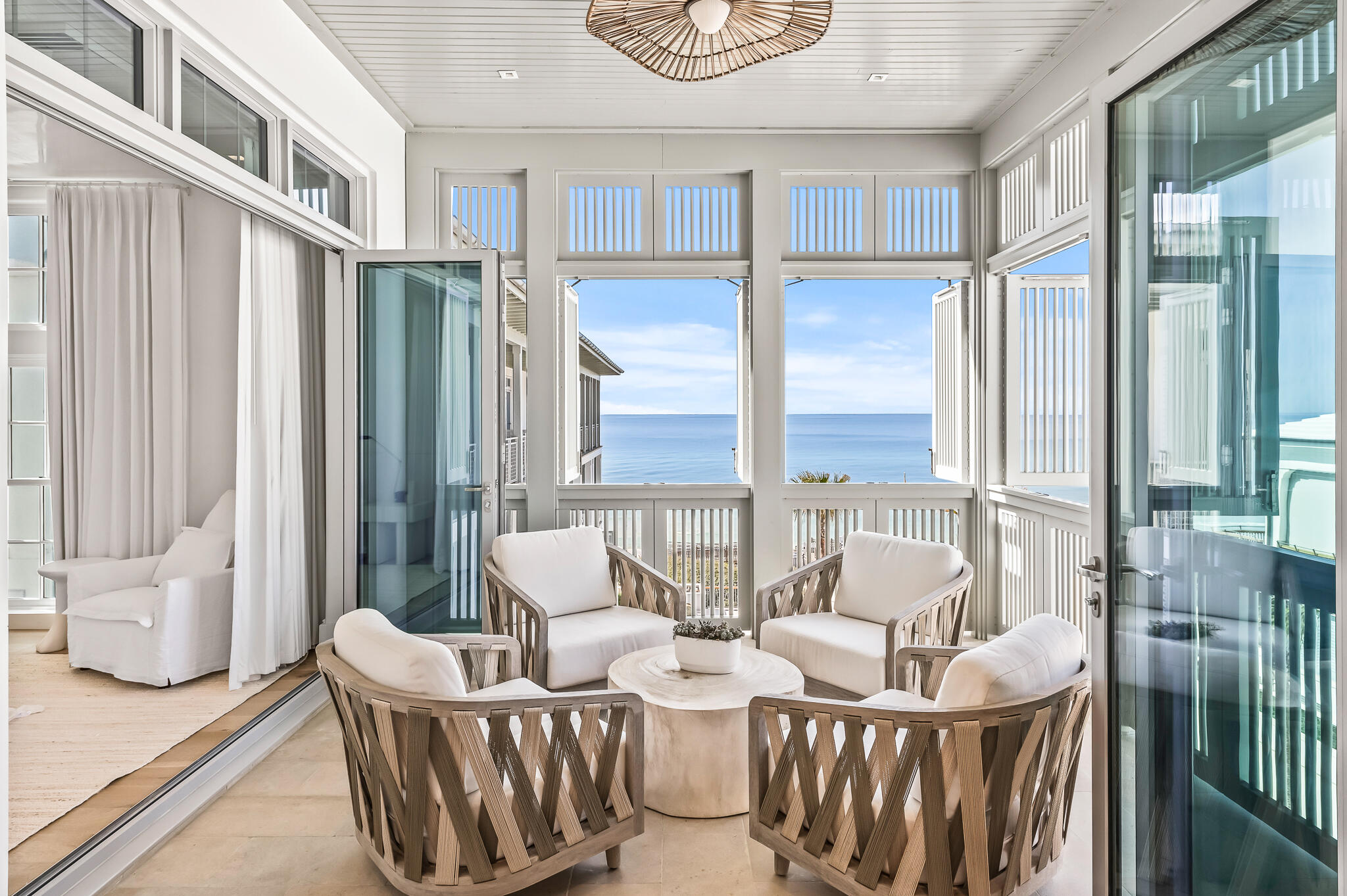 290 Sea Garden St Inlet Beach, Unit 402 Inlet Beach, FL 32461 - Photo 2 of 43 a living room with patio furniture and a large window