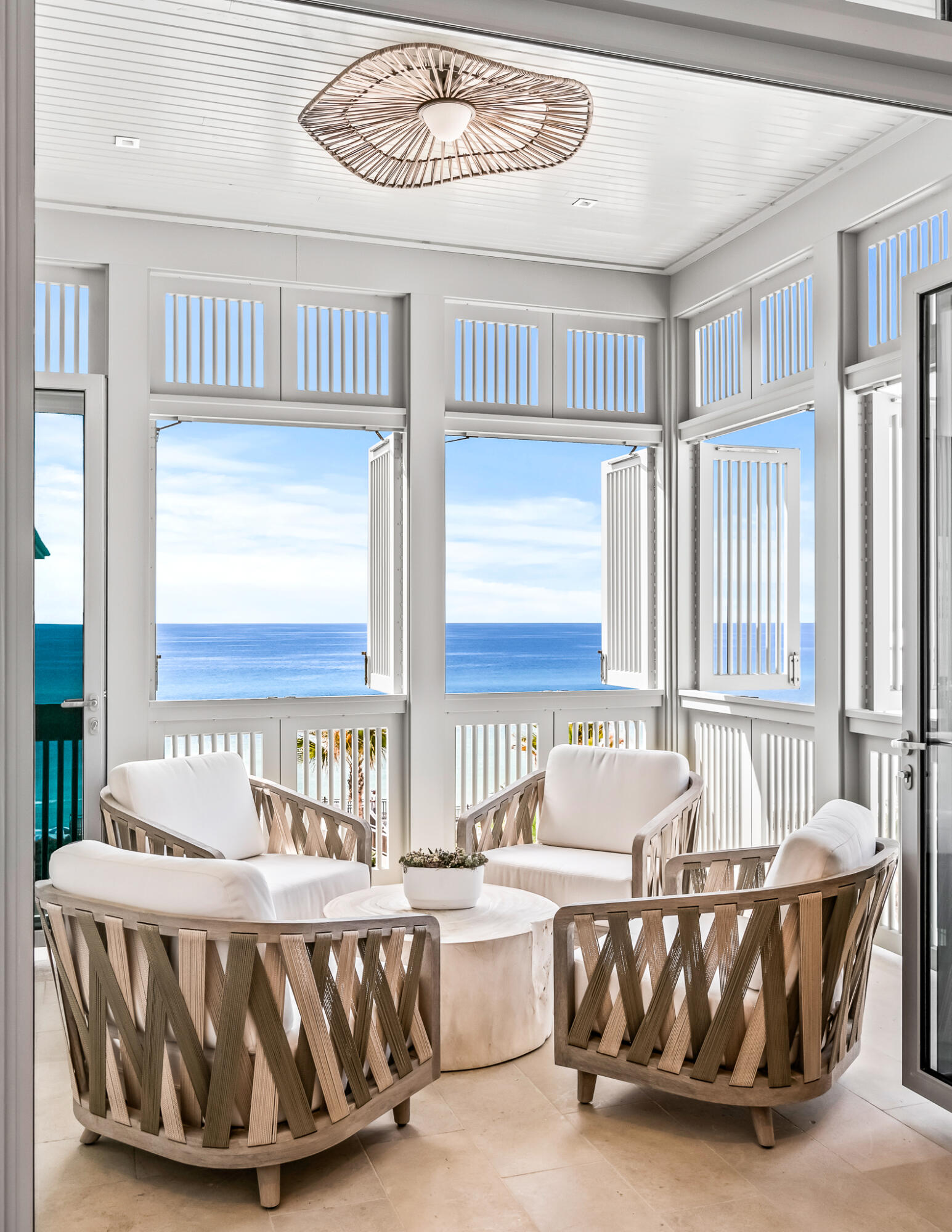 290 Sea Garden St Inlet Beach, Unit 402 Inlet Beach, FL 32461 - Photo 22 of 43 a living room with a couch and a table