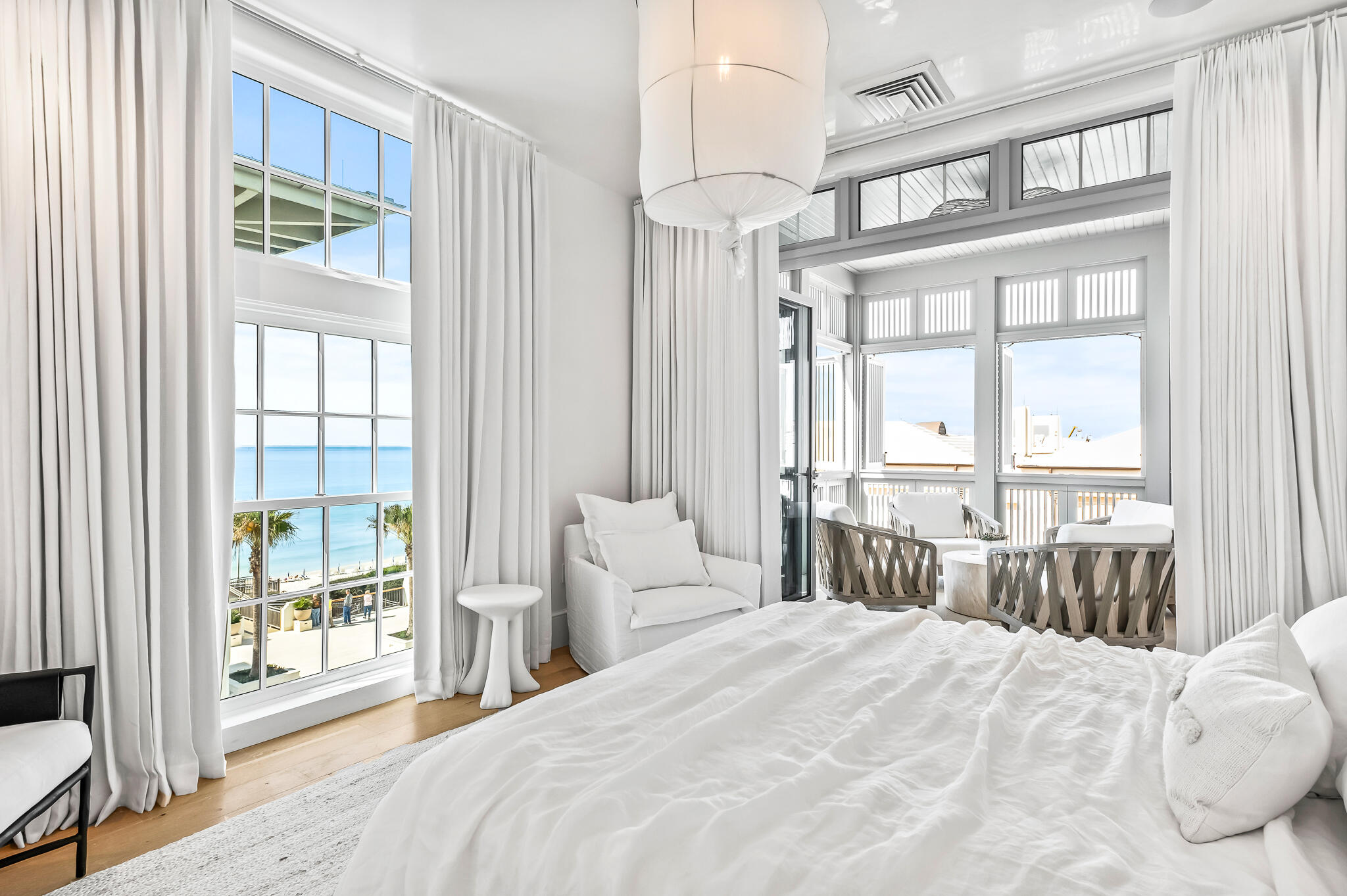 290 Sea Garden St Inlet Beach, Unit 402 Inlet Beach, FL 32461 - Photo 8 of 43 a bedroom with a bed and a large window