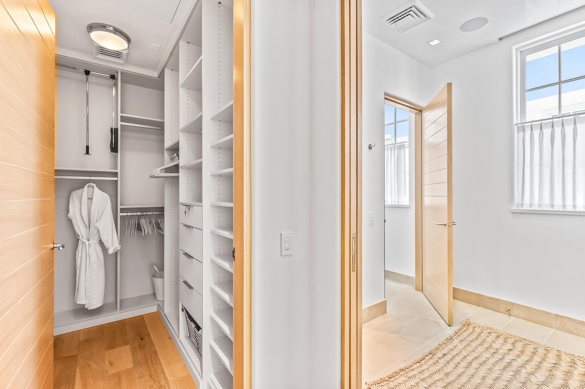 290 Sea Garden St Inlet Beach, Unit 402 Inlet Beach, FL 32461 - Photo 9 of 43 a view of walk in closet with window and bathroom