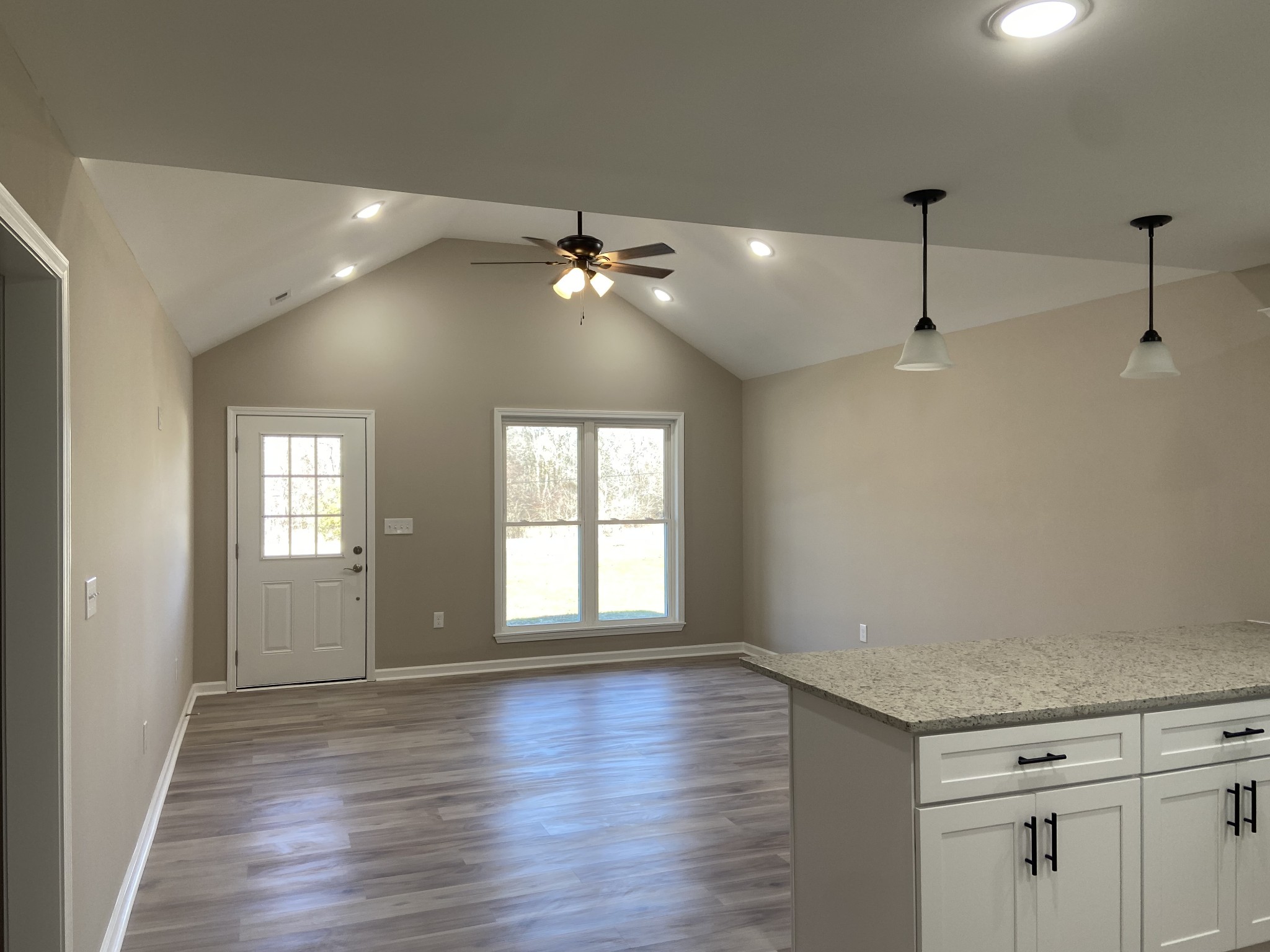 271 Chicken Creek Road Pulaski, TN 38478 - Photo 3 of 13 a view of an empty room with a window and wooden floor