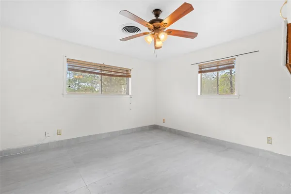 a view of a swimming pool with a yard