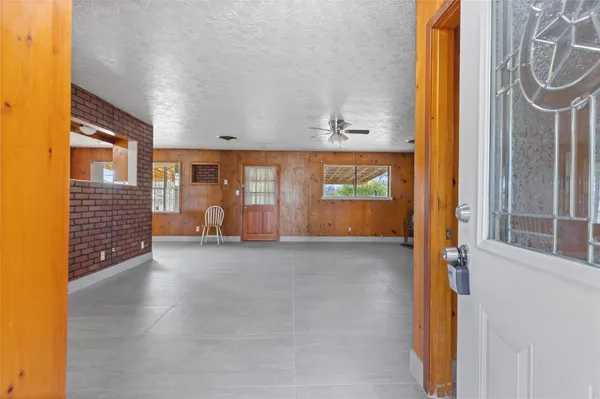 a kitchen with stainless steel appliances granite countertop a refrigerator and a stove