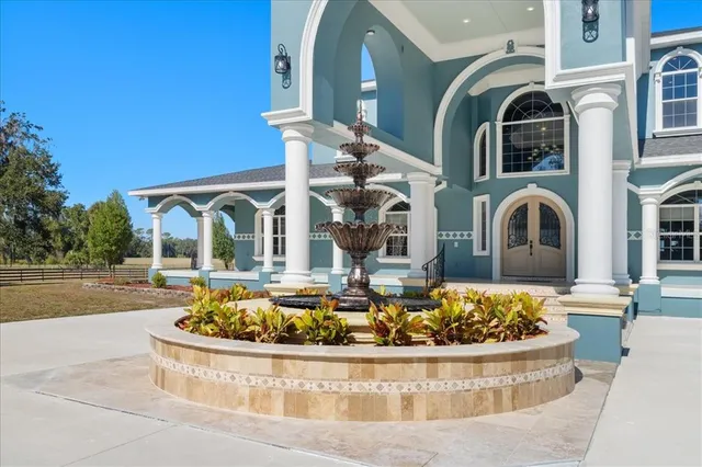 a bathroom with a granite countertop sink a toilet and bathtub