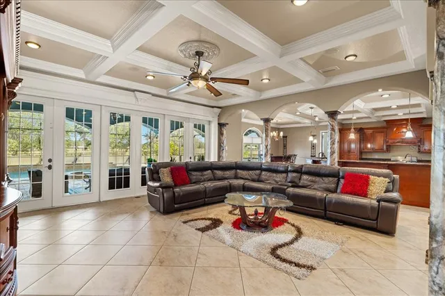 a view of a swimming pool with potted plants
