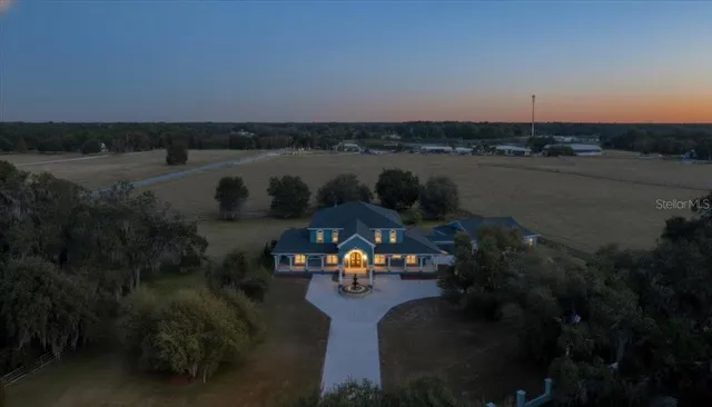 a large kitchen with stainless steel appliances granite countertop a large stove a sink dishwasher and cabinets with wooden floor