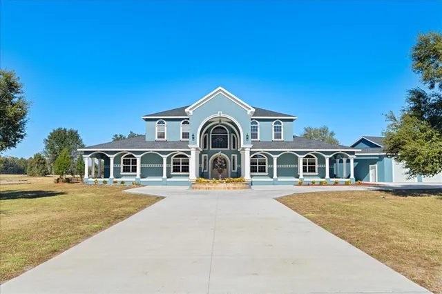 a kitchen with stainless steel appliances granite countertop a refrigerator and wooden cabinets