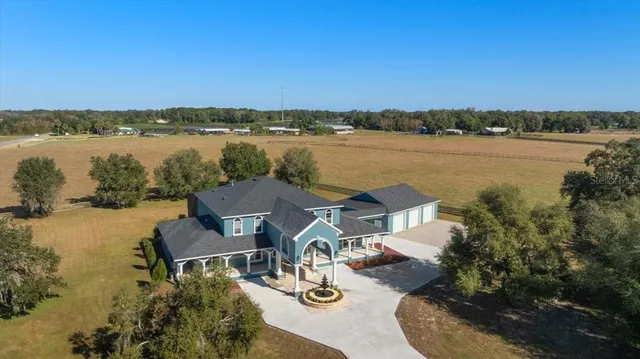 a view of a dining room with furniture and window