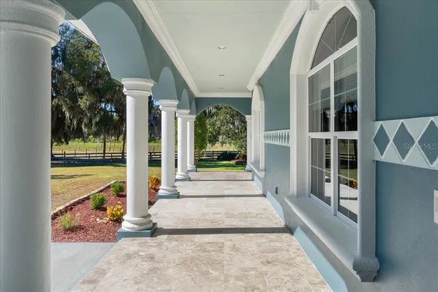 a bedroom with a large bed and a book shelf